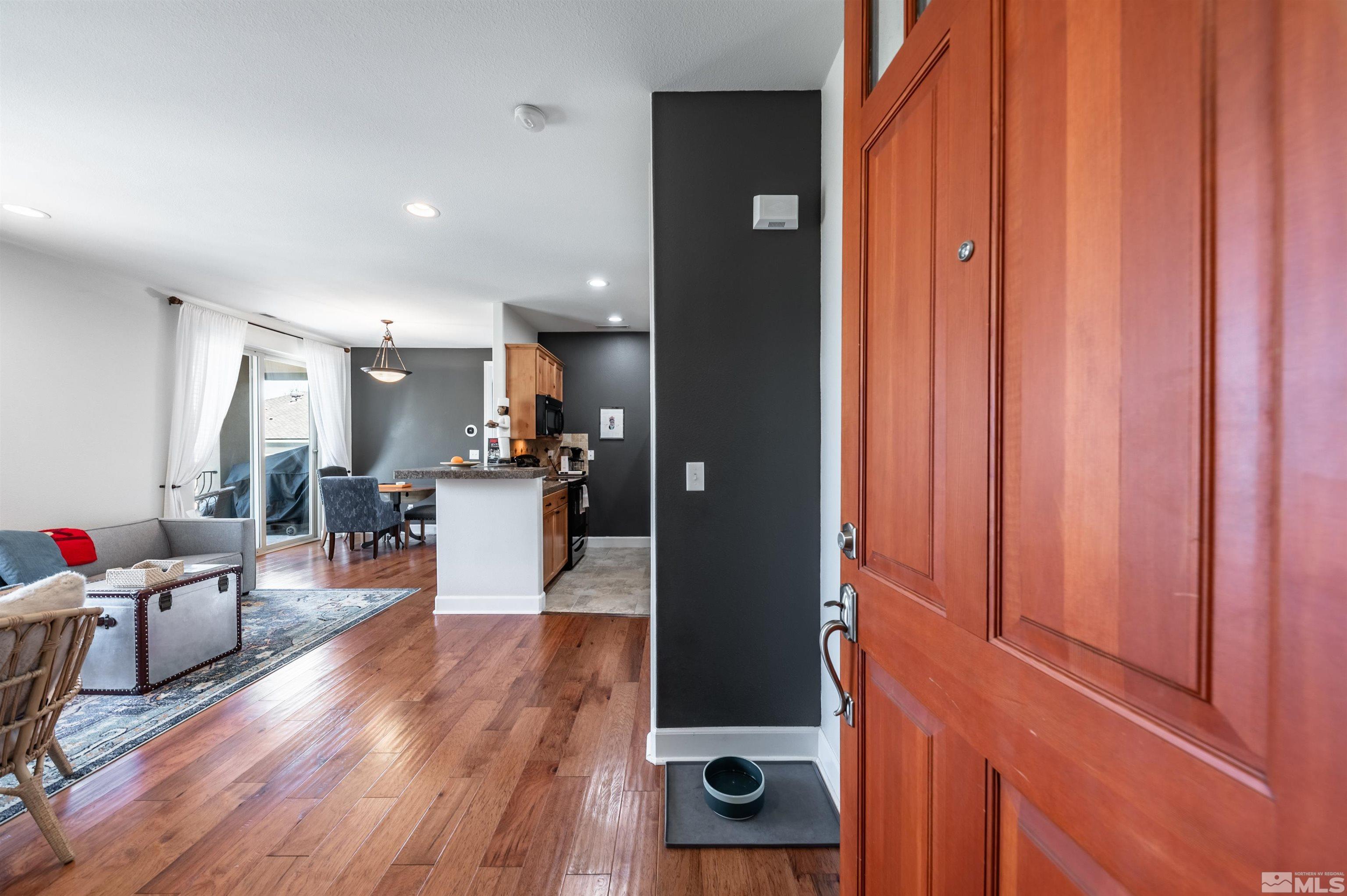 3677 Warren Way, Unit C Reno, NV 89509 - Photo 5 of 23 a view of a living room and a wooden floor