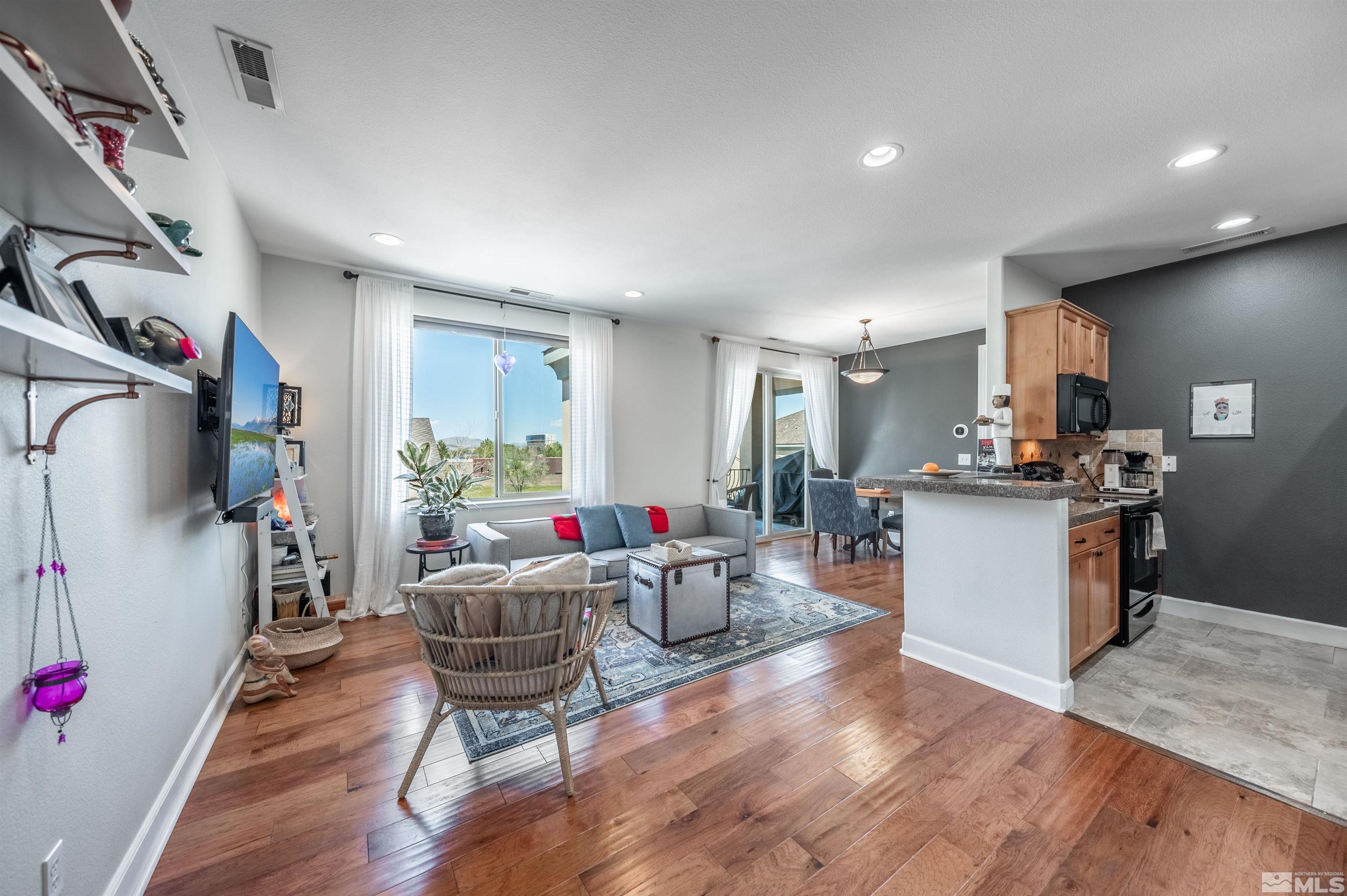 3677 Warren Way, Unit C Reno, NV 89509 - Photo 6 of 23 a living room with furniture and kitchen view