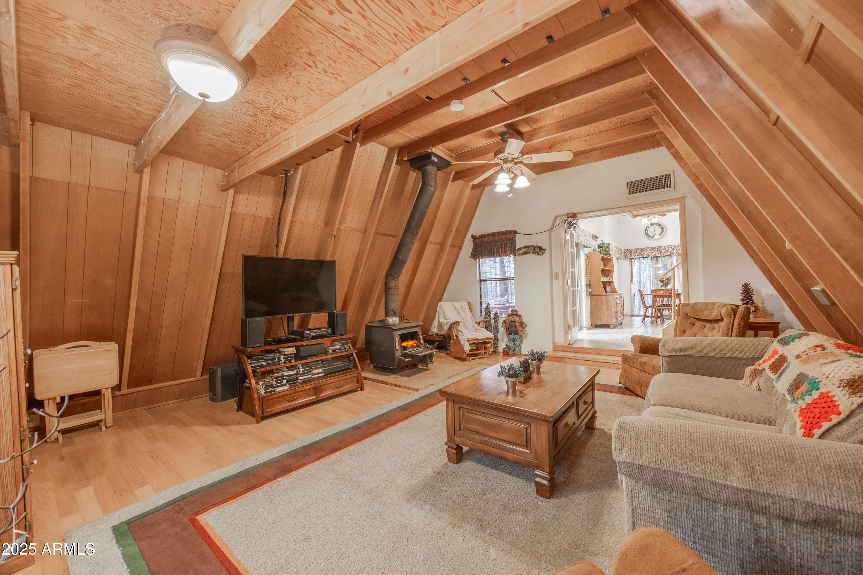 1643 Rifle Way Forest Lakes, AZ 85931 - Photo 23 of 40 a living room with furniture a ceiling fan and a window