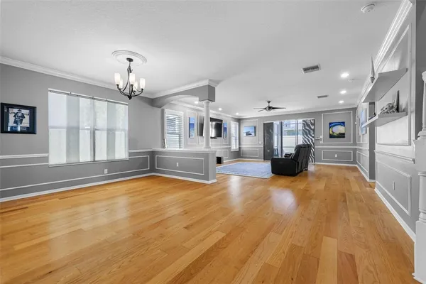 a view of kitchen and hall with wooden floor