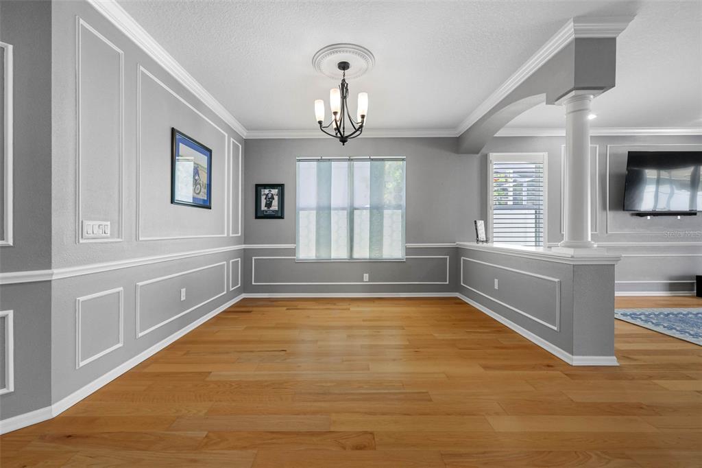 2510 Cross More Street Valrico, FL 33594 - Photo 14 of 43 a view of an empty room with a window and wooden floor
