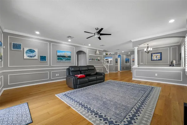 a living room with furniture and a rug