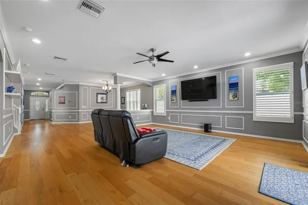 a living room with fireplace furniture and a flat screen tv