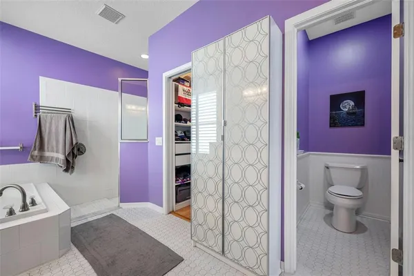 a bathroom with a toilet sink and shower