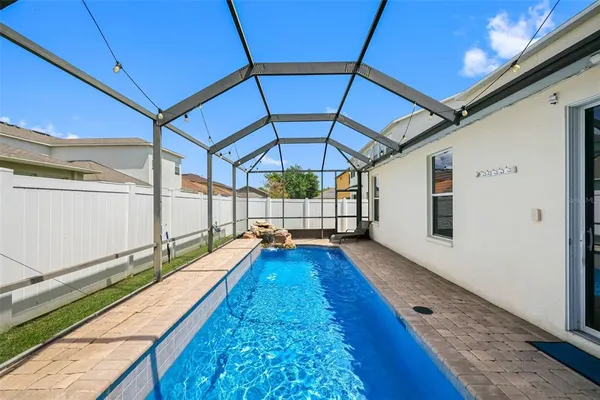 a view of swimming pool with a bench