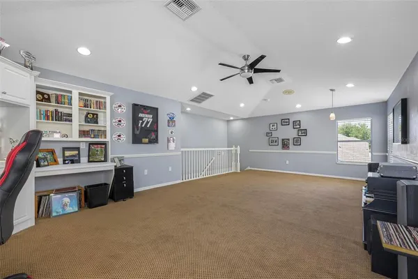 an aerial view of residential houses with outdoor space and street view