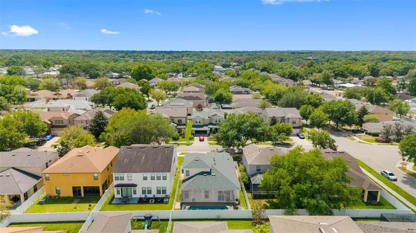 an aerial view of residential houses with swimming pool