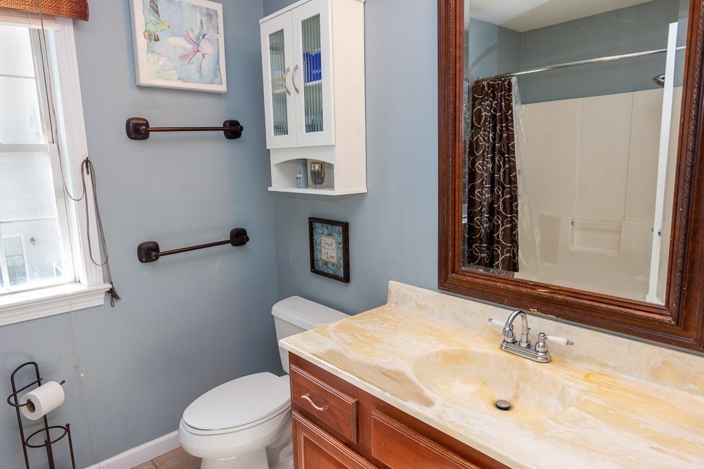13 Annies Way Springfield, MA 01119 - Photo 24 of 42 a bathroom with a sink toilet and mirror