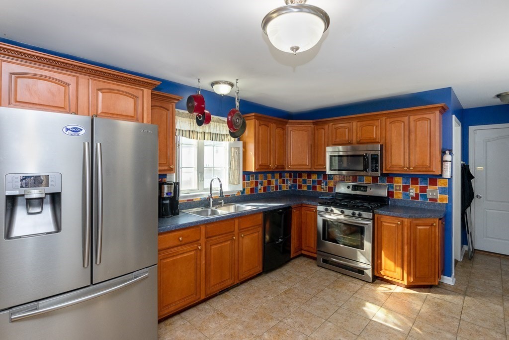 13 Annies Way Springfield, MA 01119 - Photo 3 of 42 a kitchen with stainless steel appliances granite countertop a refrigerator a sink dishwasher stove top oven and cabinets