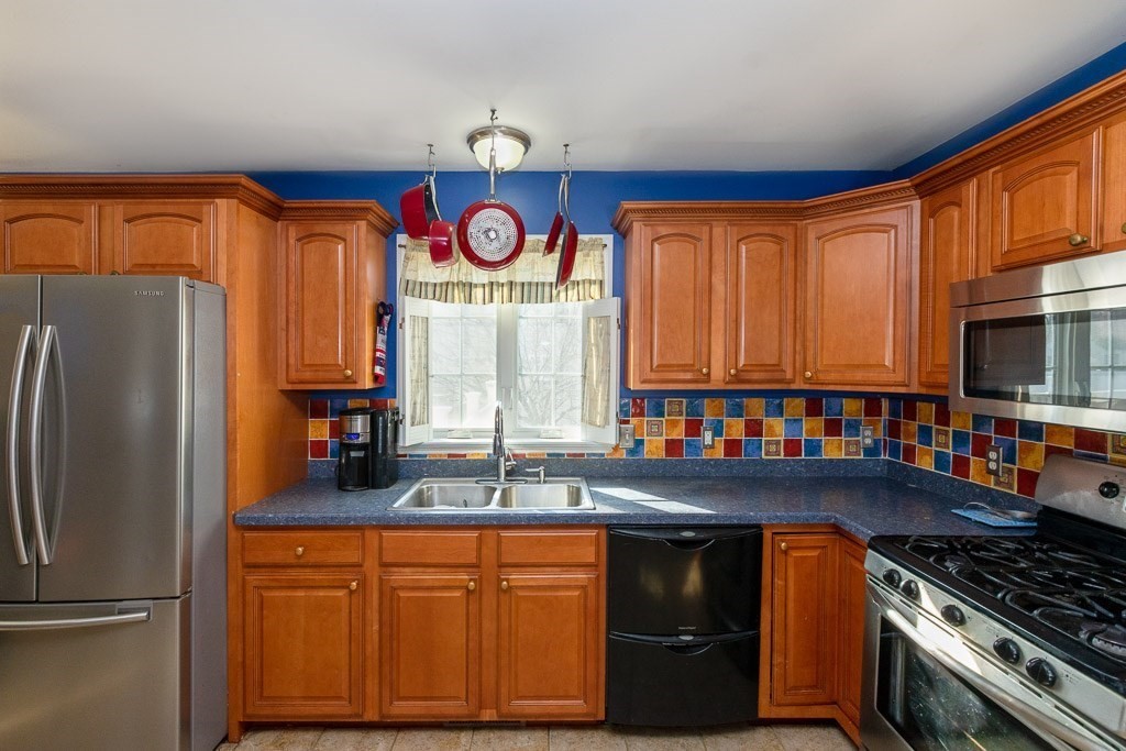 13 Annies Way Springfield, MA 01119 - Photo 4 of 42 a kitchen with stainless steel appliances granite countertop a refrigerator and a sink