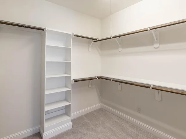 a view of an empty walk in closet