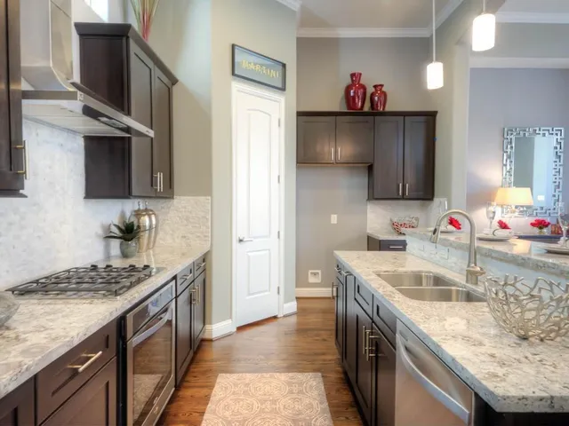 a kitchen that has a sink and a stove