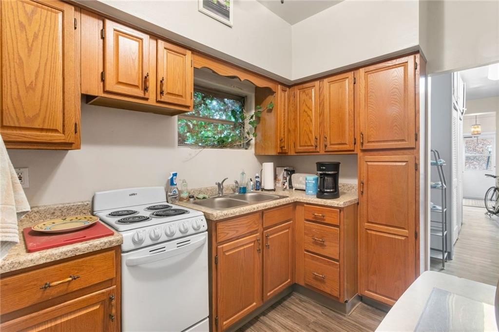 425 Braddock Road Pittsburgh, PA 15221 - Photo 13 of 39 a kitchen with stainless steel appliances granite countertop a refrigerator sink and cabinets