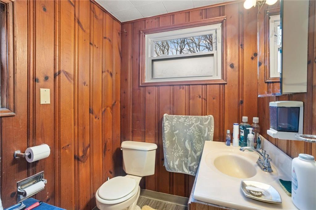 425 Braddock Road Pittsburgh, PA 15221 - Photo 14 of 39 a white toilet sitting next to a bathroom sink and tub