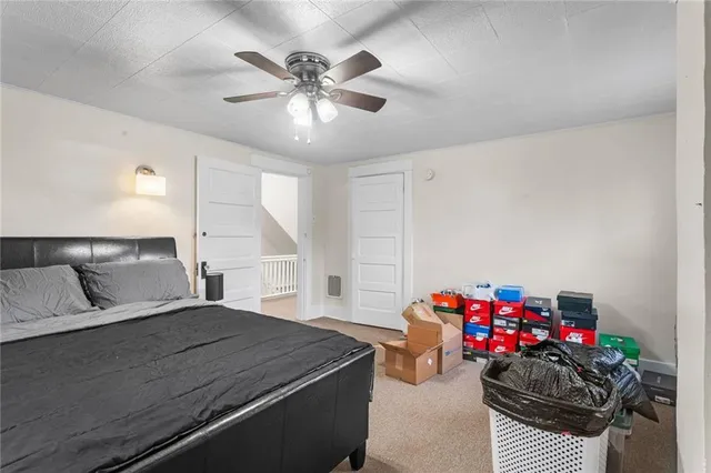 a bedroom with furniture and a chandelier