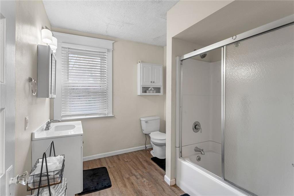 425 Braddock Road Pittsburgh, PA 15221 - Photo 23 of 39 a bathroom with a bathtub a toilet and a shower