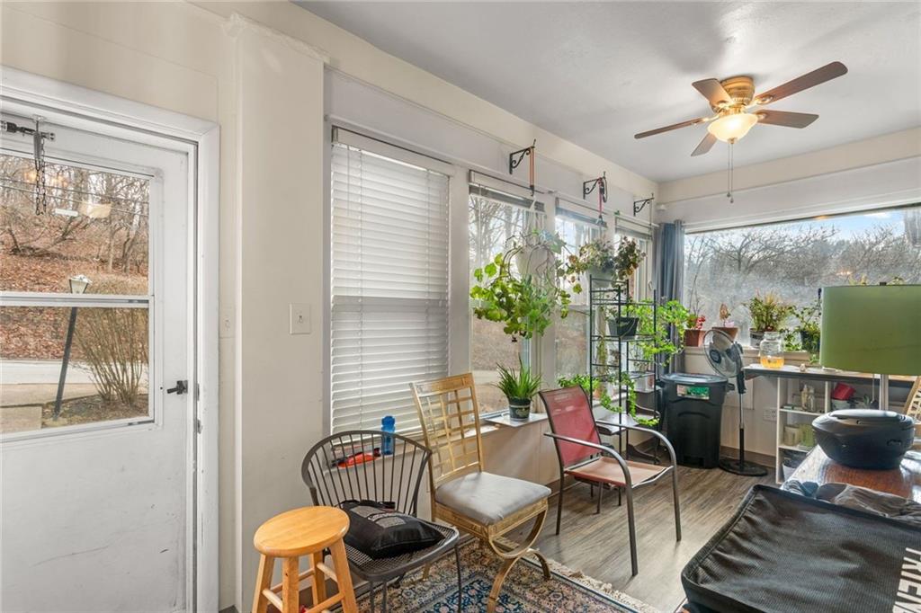 425 Braddock Road Pittsburgh, PA 15221 - Photo 3 of 39 a living room with furniture and a large window