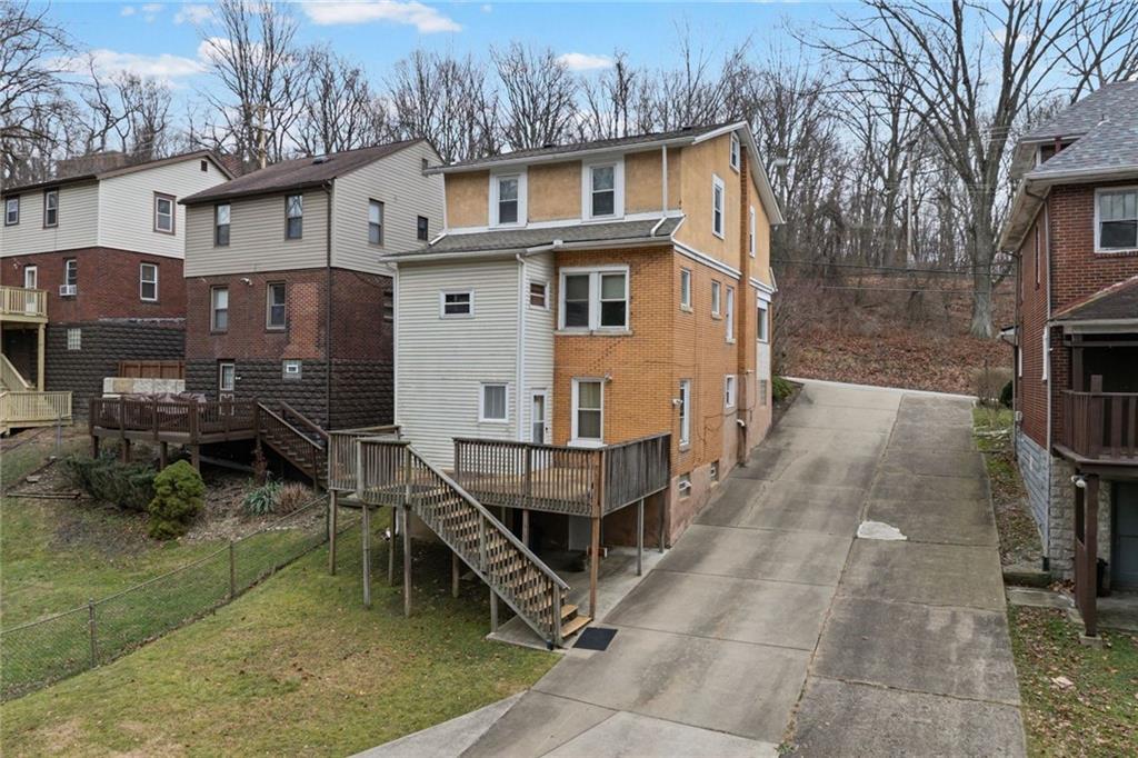 425 Braddock Road Pittsburgh, PA 15221 - Photo 34 of 39 a view of a house with backyard and sitting area