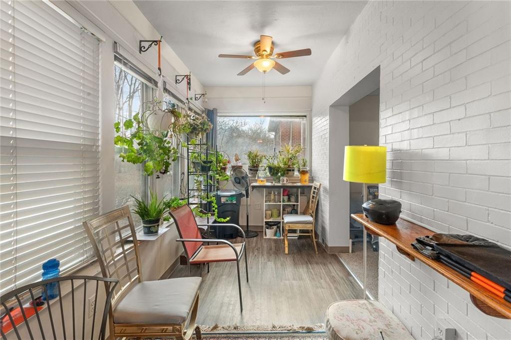 425 Braddock Road Pittsburgh, PA 15221 - Photo 5 of 39 a living room with furniture and a potted plant