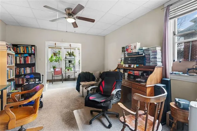 a room with furniture and a bookshelf