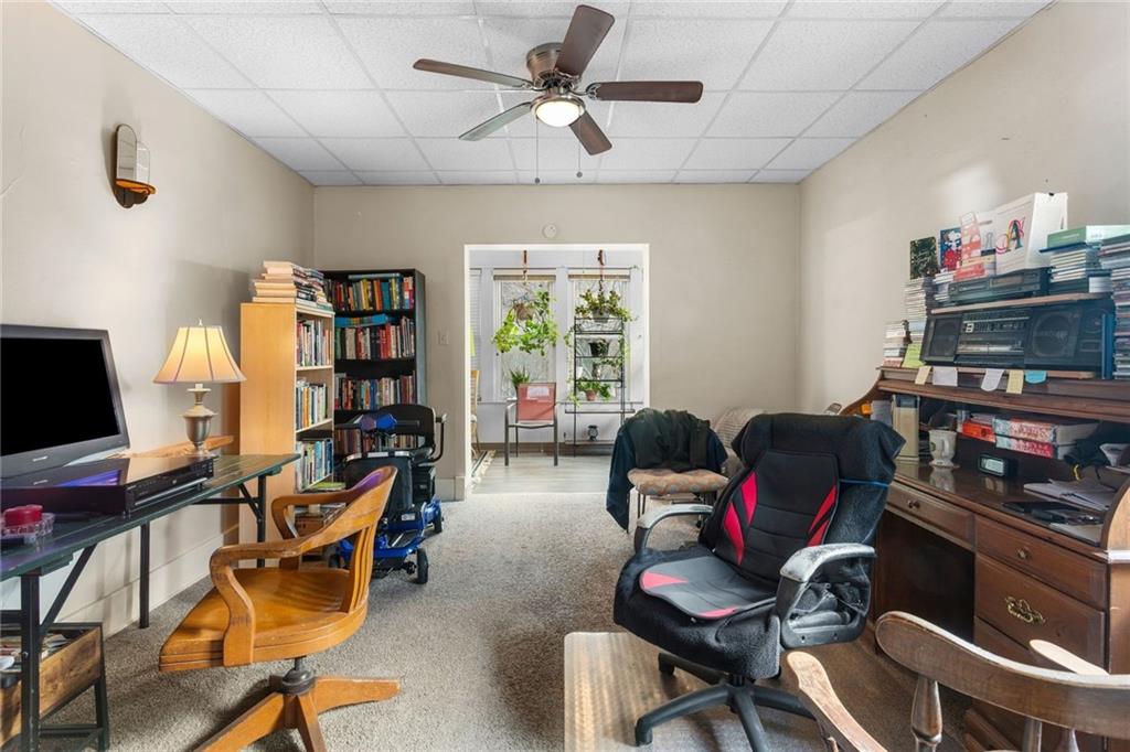 425 Braddock Road Pittsburgh, PA 15221 - Photo 7 of 39 a livingroom with workspace and a window