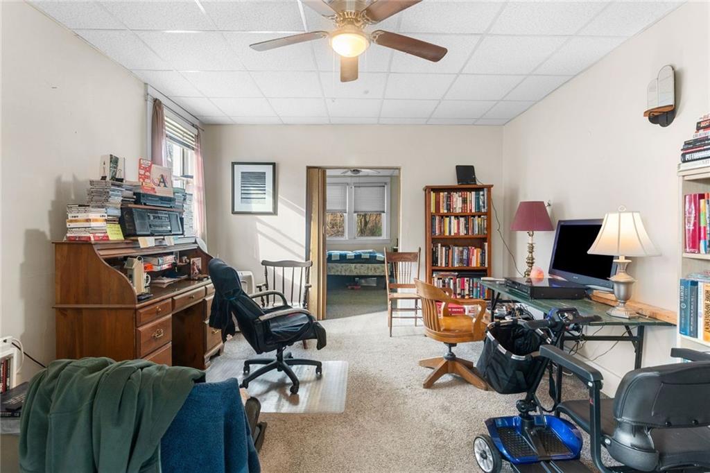 425 Braddock Road Pittsburgh, PA 15221 - Photo 8 of 39 a view of a workspace with furniture and toys