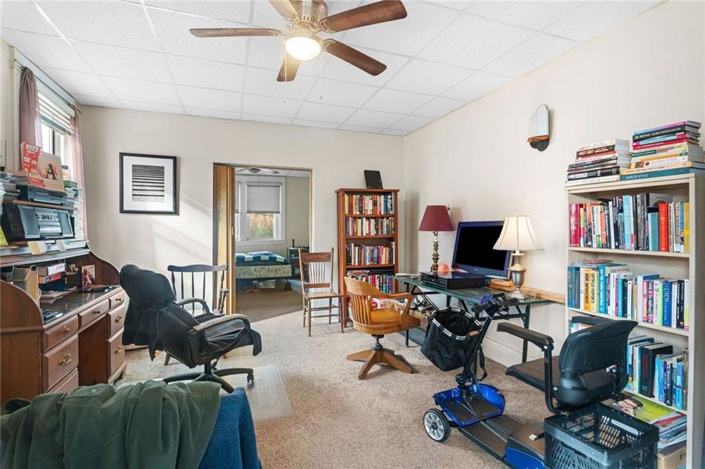 425 Braddock Road Pittsburgh, PA 15221 - Photo 9 of 39 a view of a livingroom with workspace and a window