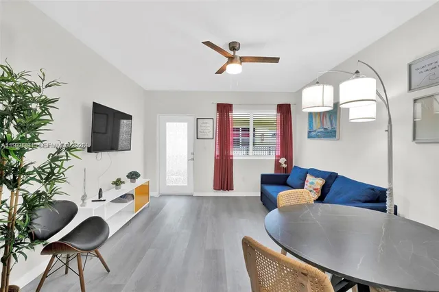 a living room with furniture fireplace and a flat screen tv