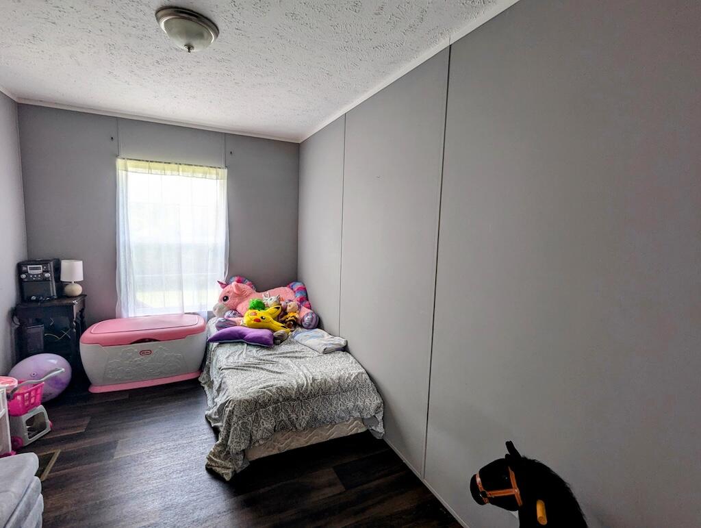 515 Windsor Road Northwest Willis, VA 24380 - Photo 15 of 30 a bedroom with bed and a window