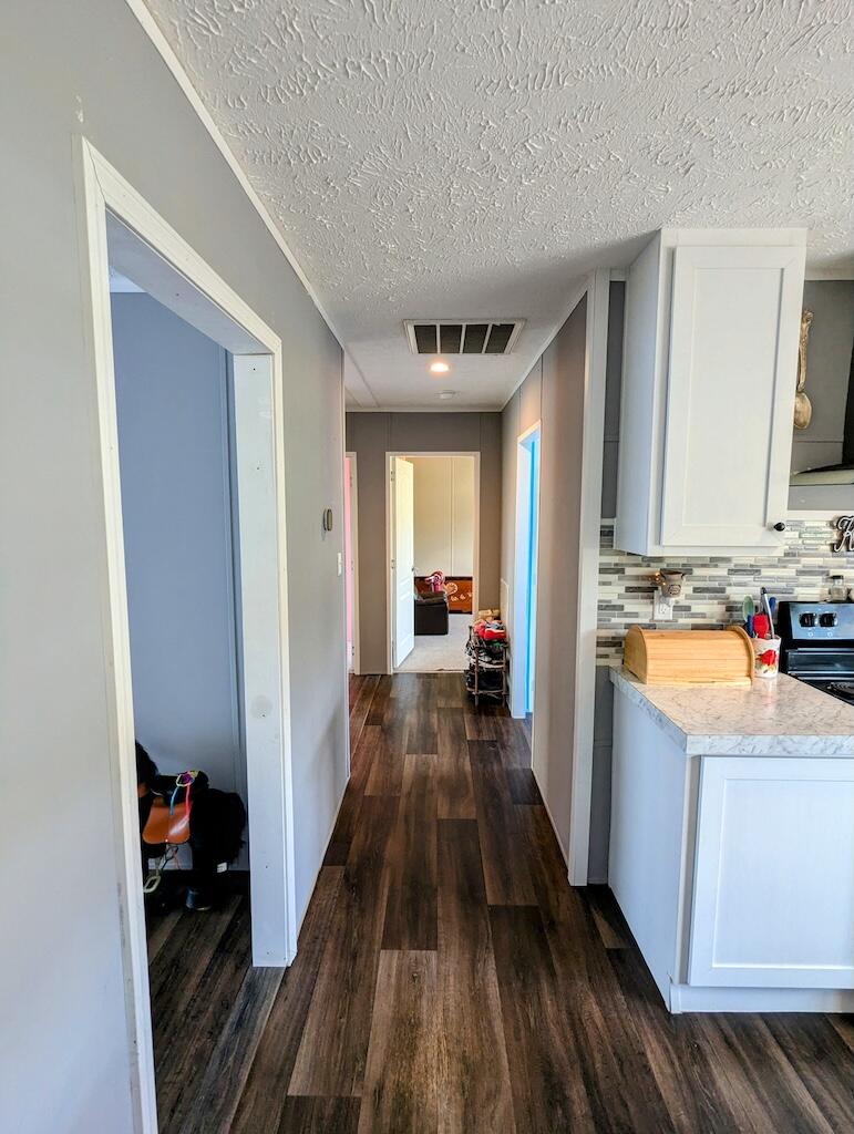 515 Windsor Road Northwest Willis, VA 24380 - Photo 16 of 30 a view of a kitchen with a sink and wooden floor