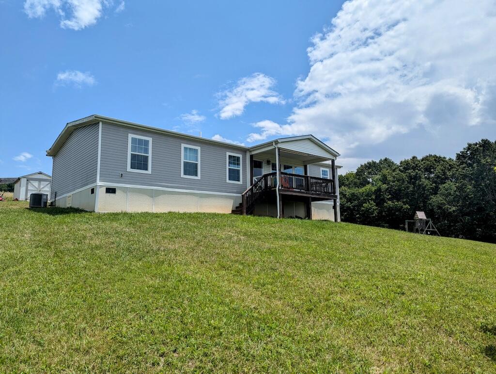 515 Windsor Road Northwest Willis, VA 24380 - Photo 2 of 30 a view of a house with a garden