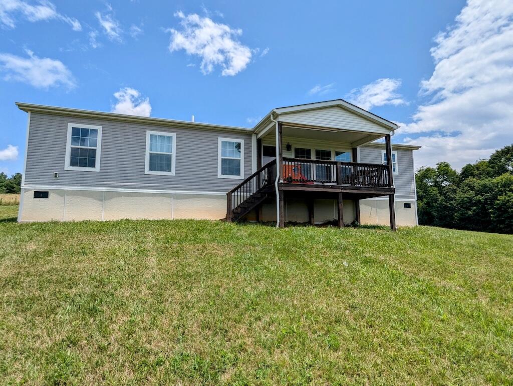 515 Windsor Road Northwest Willis, VA 24380 - Photo 3 of 30 a house view with a garden space