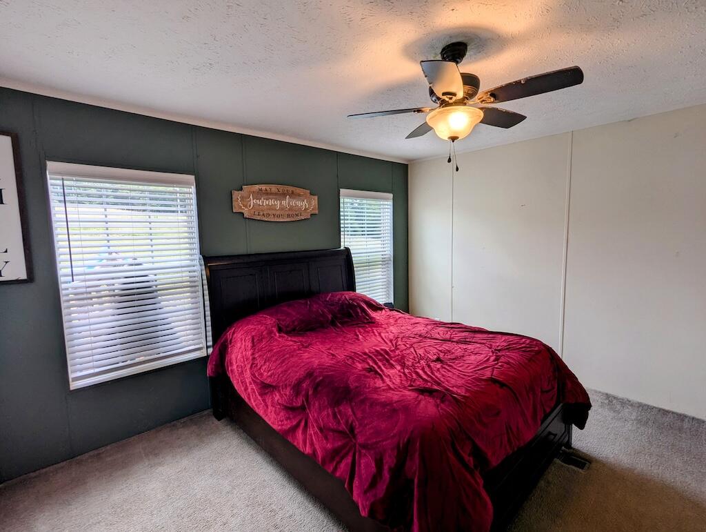 515 Windsor Road Northwest Willis, VA 24380 - Photo 10 of 30 a bedroom with a bed and a window