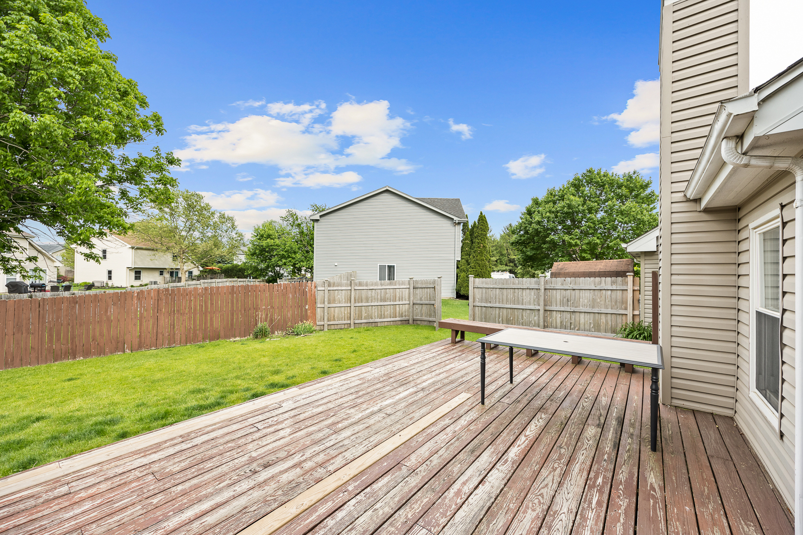 2 Buckboard Court Bolingbrook, IL 60490 - Photo 5 of 33 a view of a backyard with a wooden deck