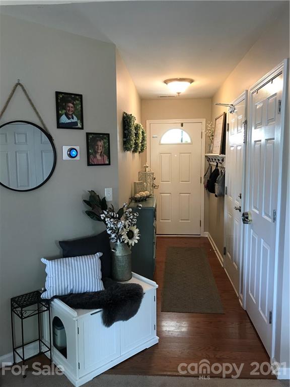 189 Pamlico Road Fletcher, NC 28732 - Photo 2 of 12 a living room with furniture and a chandelier