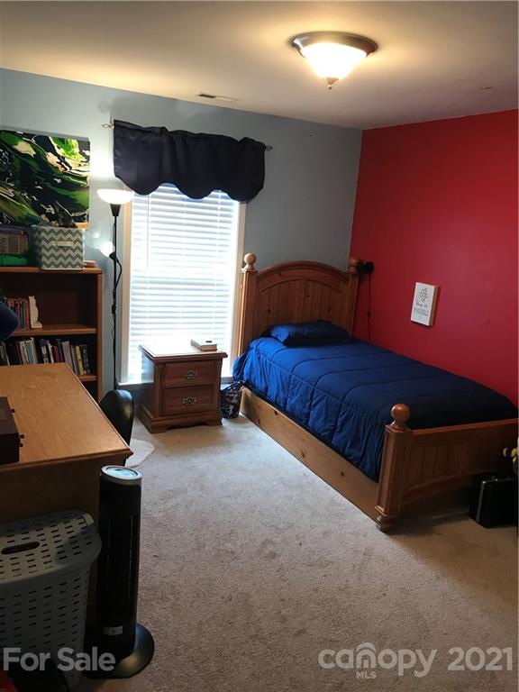 189 Pamlico Road Fletcher, NC 28732 - Photo 9 of 12 a living room with furniture flat screen tv and lamp