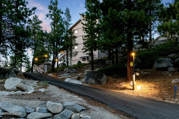 a view of a house with a mountain in the background