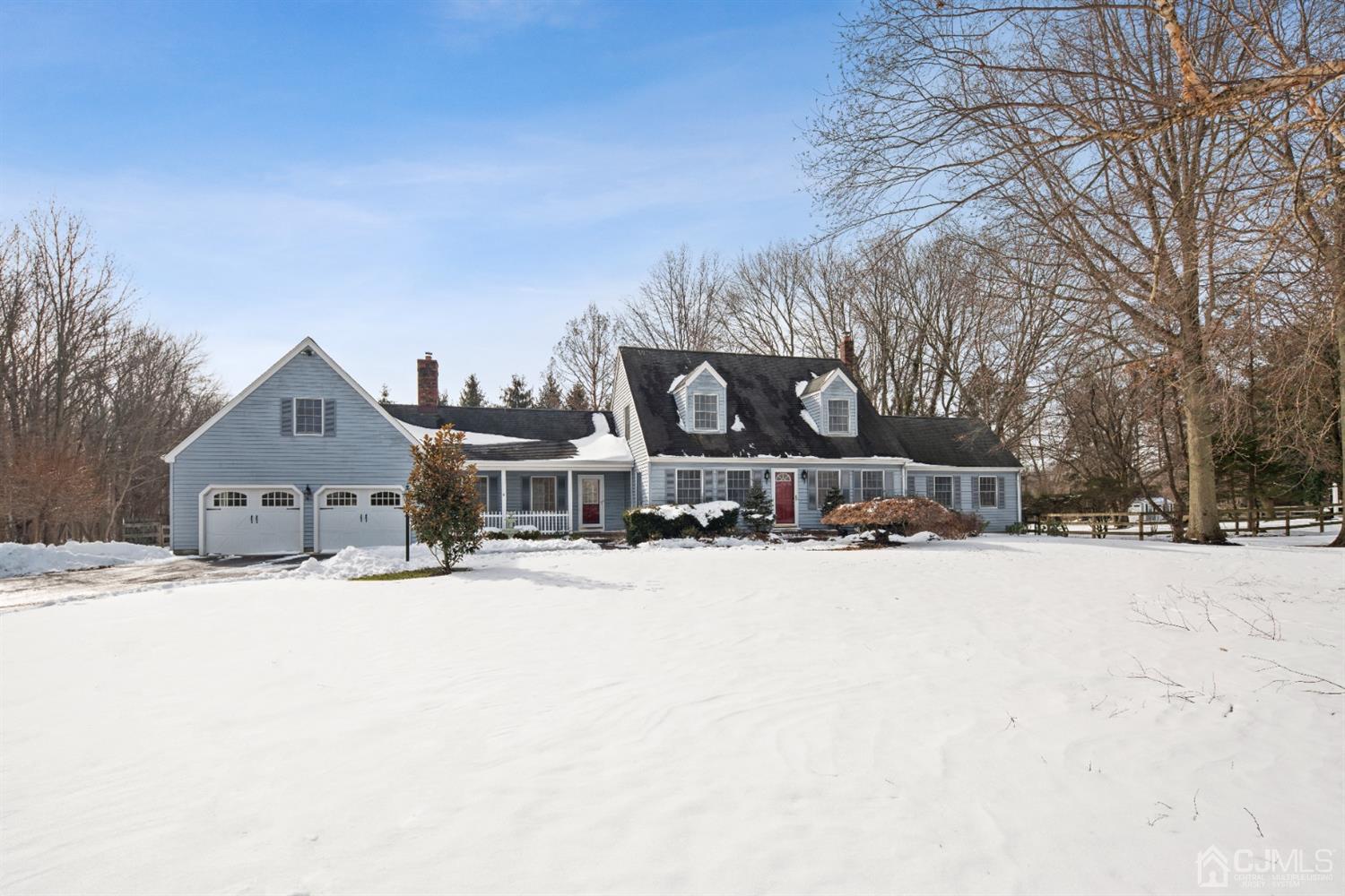 238 Dey Road Cranbury, NJ 08512 - Photo 1 of 42 a front view of a house with a yard covered in snow