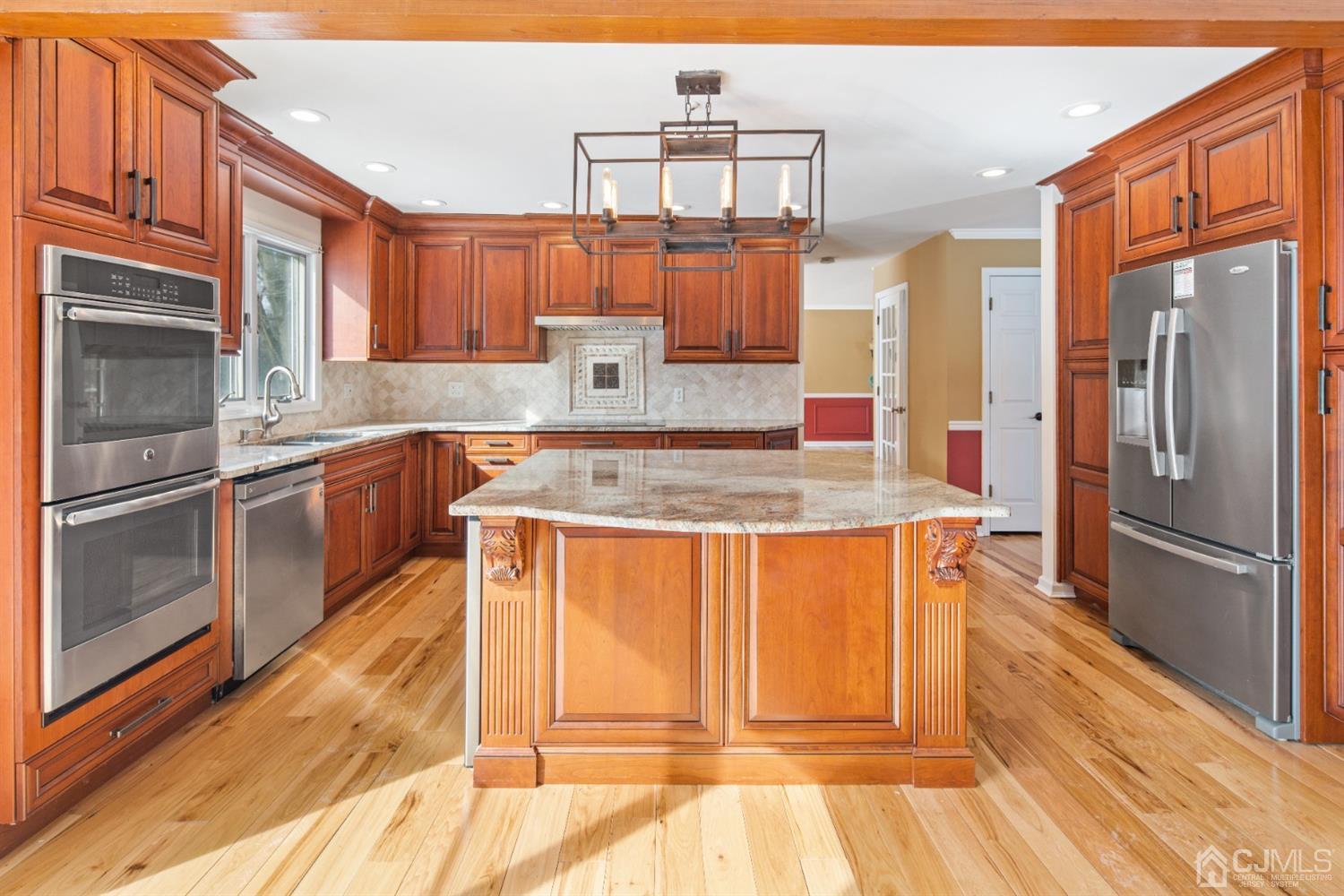 238 Dey Road Cranbury, NJ 08512 - Photo 11 of 42 a kitchen with stainless steel appliances granite countertop a refrigerator a stove and a sink
