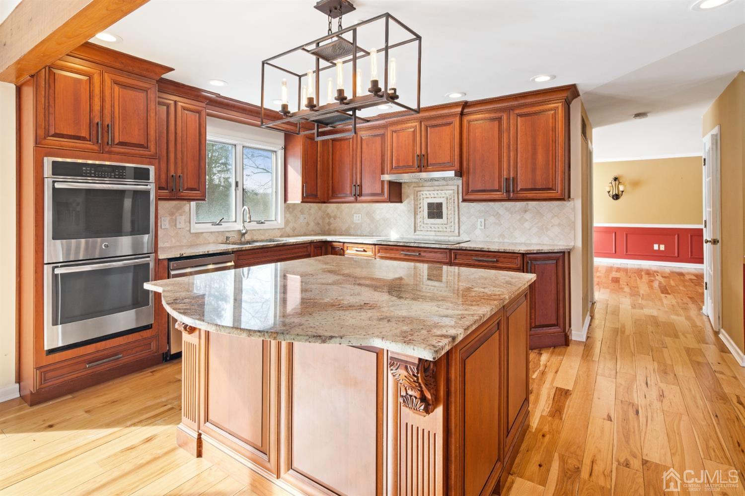 238 Dey Road Cranbury, NJ 08512 - Photo 13 of 42 a kitchen with stainless steel appliances granite countertop a sink and cabinets