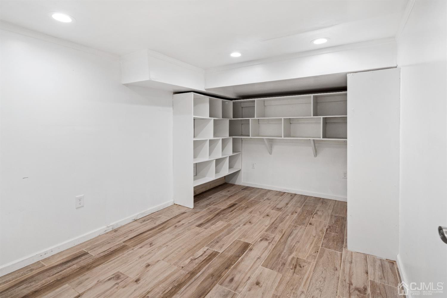 238 Dey Road Cranbury, NJ 08512 - Photo 36 of 42 a view of an empty room with wooden floor and closet