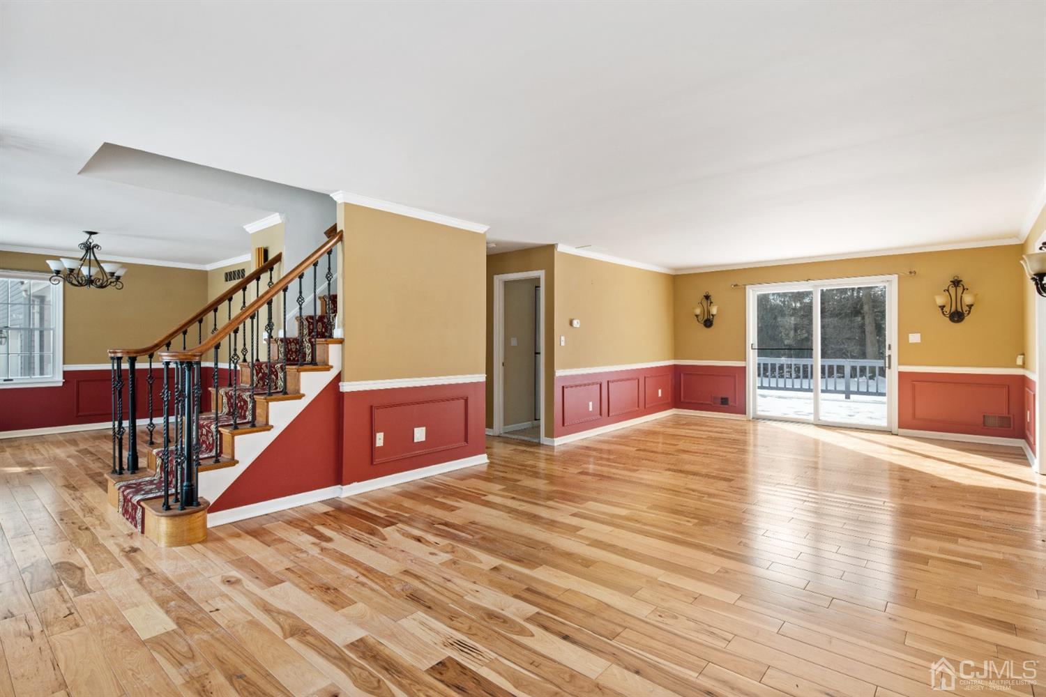 238 Dey Road Cranbury, NJ 08512 - Photo 4 of 42 a view of an empty room with wooden floor and a window