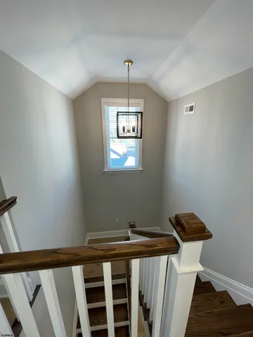 a view of a hallway with windows