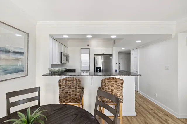 a view of a balcony with chairs