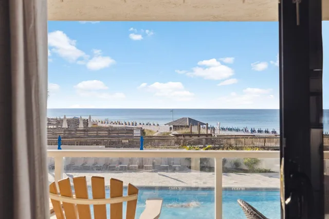 a bathroom with a granite countertop toilet a sink and a mirror