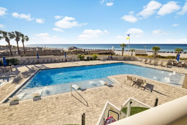 a view of swimming pool with outdoor seating