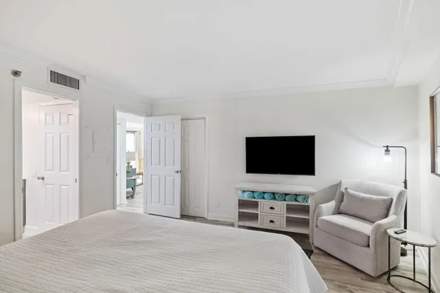 a view of a swimming pool with lounge chairs