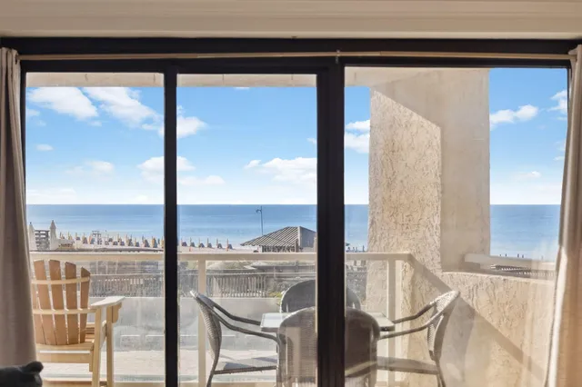 a bedroom with a bed and a night stand