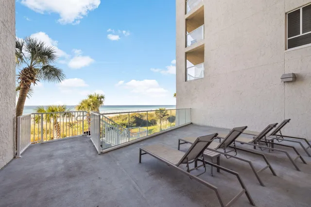 a body of water with a building in the background