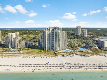 a view of fountain with tree in the background